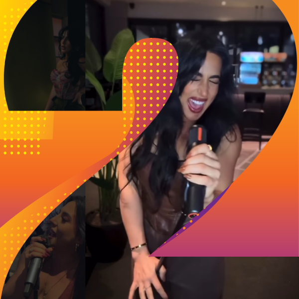 Femail singer performing into a microphone